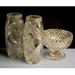 A 19th Century cut crystal bowl, Dia. 22cm together with a pair of cut crystal vases.