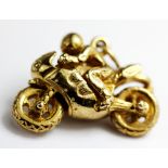 A 9ct yellow gold motorbike shaped pendant,3 x 2cm.