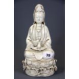 A Chinese blanc de chine porcelain figure of the goddess Guanyin, H. 26cm.
