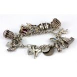 A hallmarked silver and other charm bracelet.