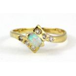 A 14ct yellow gold opal and white stone set ring, (I.5)