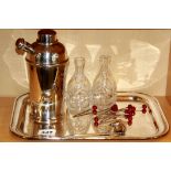 A silver plated tray, cocktail shaker and other items.