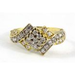 A 9ct yellow gold stone set cluster ring, (R).