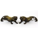 A pair of Chinese gilt bronze tigers decorated with lucky cash, L. 25cm.