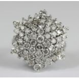 An 18ct white gold diamond set large cluster ring, approx. 2.5-3ct overall, Dia. 2.4cm, (L).
