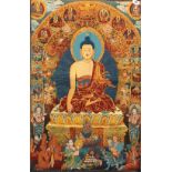 A Tibetan woven Thangka of the Buddha surrounded by other Buddha images and deities, 92 x 60cm.