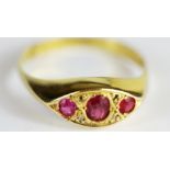 An 18ct yellow gold ruby and diamond set ring, (two diamonds missing), (P).