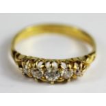 An 18ct yellow gold five old cut diamond set ring, (N)