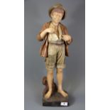 A Goldscheider figure of a boy, H. 58cm. A/F