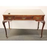 A 19th Century mahogany dressing table/desk with inset glass top, W. 102cm.
