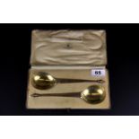 A pair of Mappin & Webb cased hallmarked silver presentation spoons, L. 19.5cm.