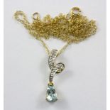 A yellow metal (tested 9ct gold) aquamarine and diamond set pendant on a 9ct gold chain.