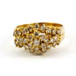An 18ct yellow gold (stamped 750) diamond set cluster ring, ( estimated over 1ct of diamonds), (L).