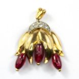 A yellow metal (tested high carat gold) ruby and diamond set pendant, L. 3cm.