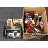 A box of diecast model vehicles.