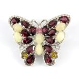 A 925 silver butterfly shaped brooch set with opals and pearl cut tourmalines, 3.5 x 3cm.