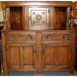 A carved oak court cabinet, W. 140cm H. 143cm.