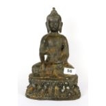 A Chinese bronze figure of a seated Buddha, H. 28cm.