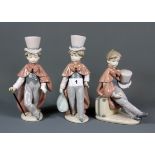Three Lladro figures of boys in top hats, tallest H. 22.5cm, (with boxes).