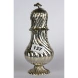 An early Victorian hallmarked silver sugar shaker, H. 20cm.