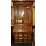 A 1920's oak and leaded glass bureau bookcase, W. 90cm H. 205cm.