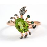 A 925 silver rose gold gilt crab shaped ring set with an oval cut peridot, chrome diopside and white