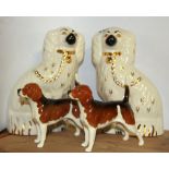 A pair of Beswick Staffordshire style dogs and a pair of beagles.