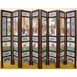 An eight fold Chinese wood and hand painted porcelain screen, H. 79cm W. 124cm.
