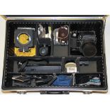 A photographic carrying case with a Bronica SQ camera etc.