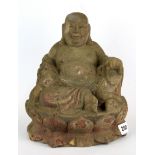 A Chinese carved wooden figure of the seated happy Buddha, H. 25cm.