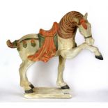A Chinese painted pottery Tang dynasty style horse figure, H. 30cm.