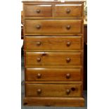 A seven drawer pine chest, W. 76cm H. 134cm.