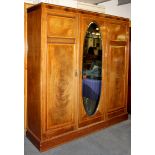 An Edwardian inlaid mahogany triple wardrobe, W. 180cm H. 200cm.