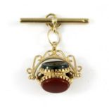 A 9ct yellow gold spinning fob with T bar, set with onyx, cornelian and bloodstone, L. 3cm.
