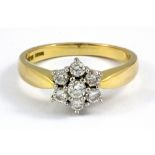 An 18ct yellow gold diamond set cluster ring, approx. 0.65ct, (P.5).