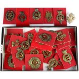 A small collection of military cap badges.