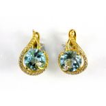 A pair of 925 silver gilt blue topaz and white stone set earrings, L. 1.7cm.