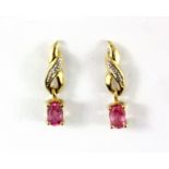 A pair of 9ct yellow gold drop earrings set with oval cut pink sapphires and diamonds, L. 1.8cm.