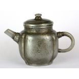 A Chinese pewter covered Yixing terracotta teapot with white jade spout and handle, H. 11cm spout to