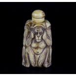 A Chinese carved bone snuff bottle of three wise monkeys, H. 7cm.