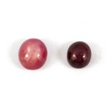 Two unmounted cabochon cut star rubies, approx. 2.5ct, 0.7 x 0.4xm & 1.47ct, 0.7 x 0.3cm.