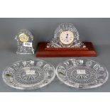Two Waterford crystal clocks and two Waterford crystal millennium collection dishes.