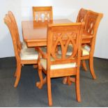 An extending dining table and six chairs.