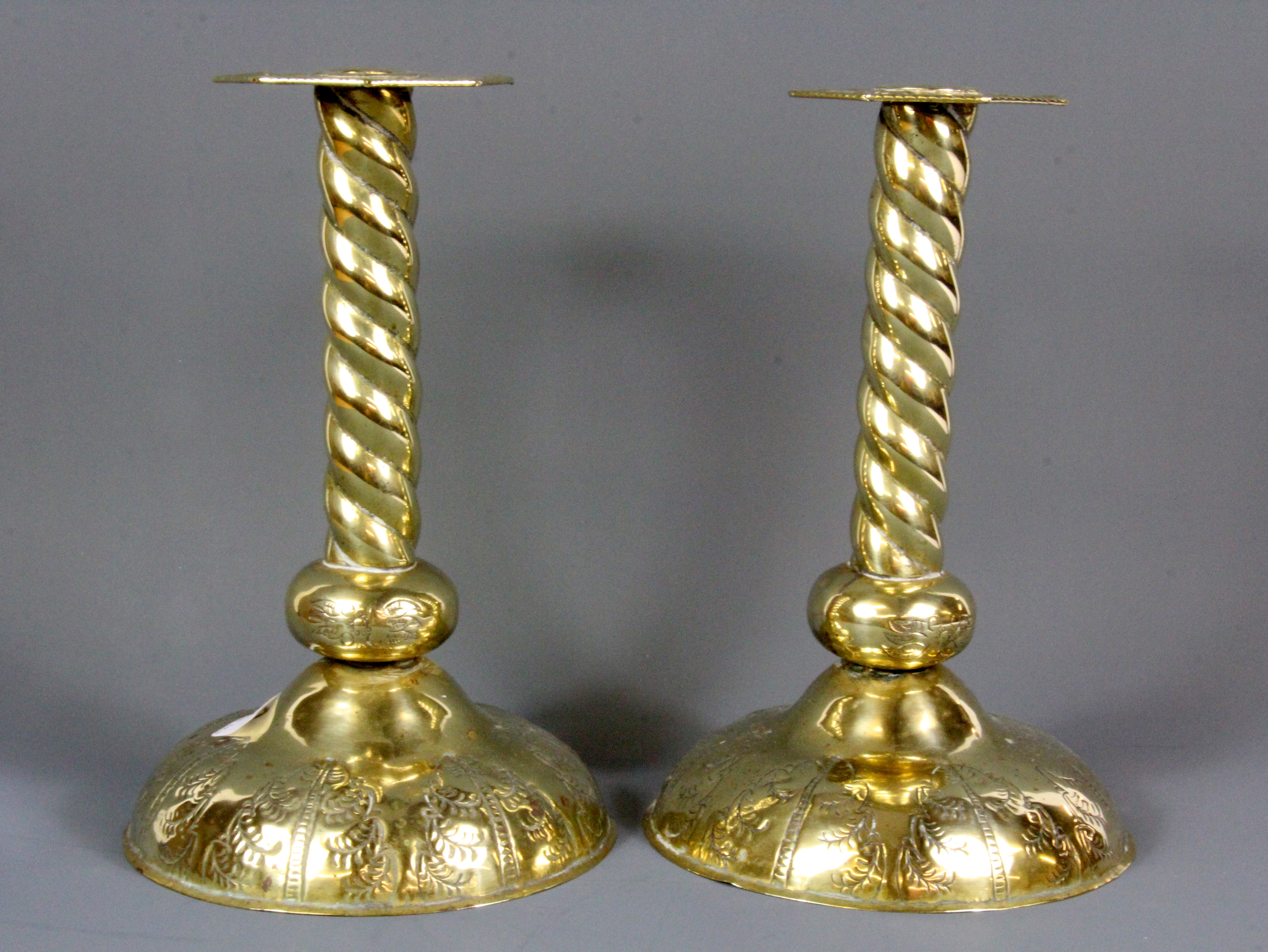 A pair of 19th Century Welsh hammered brass chapel candlesticks, H. 26cm.