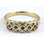 A 14ct yellow gold (stamped 14k) sapphire and diamond set ring, (R).