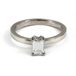 An 18ct white gold baguette cut diamond set solitaire ring, approx. 0.5ct, (treated), (M.5).