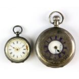 A hallmarked silver half hunter pocket watch and a lady's .935 silver watch.