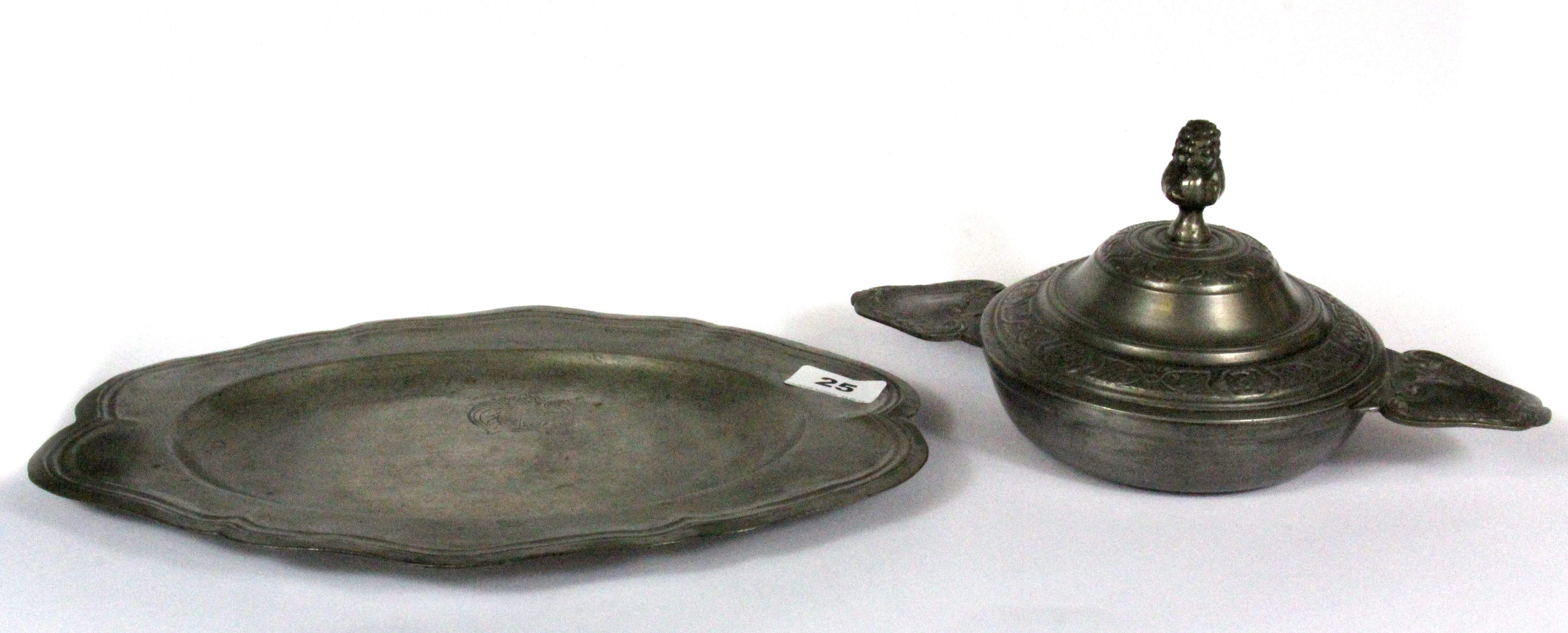A pewter platter with a pewter dish and cover, W. 33cm.