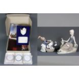 Two Lladro figures, Lladro collector's plaque and candleholder with three Lladro dishes, (with