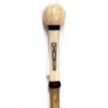 A 19th Century ivory and baleen riding crop, L. 58cm.
